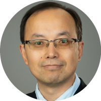 Headshot of Zhiqiang Lin wearing glasses, a suit, and a tie against a neutral background.