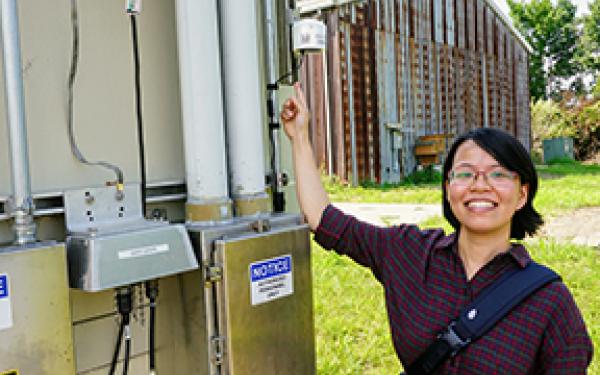 Dr. Huyen Le at the site of the NEON sensor tower at OSU