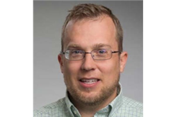 Steven Quiring headshot on grey background