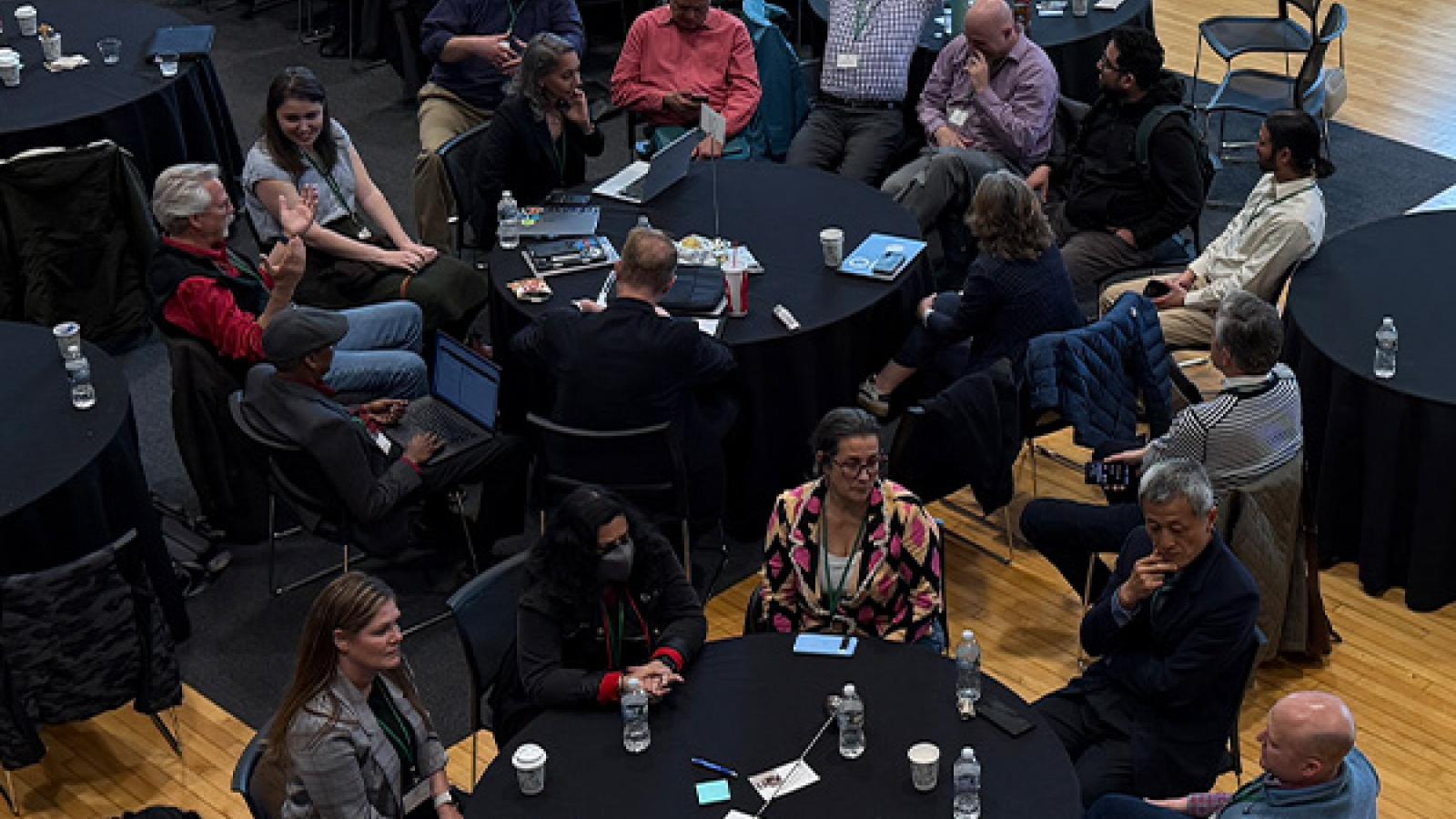 ADSA conference members sitting at tables, discussing