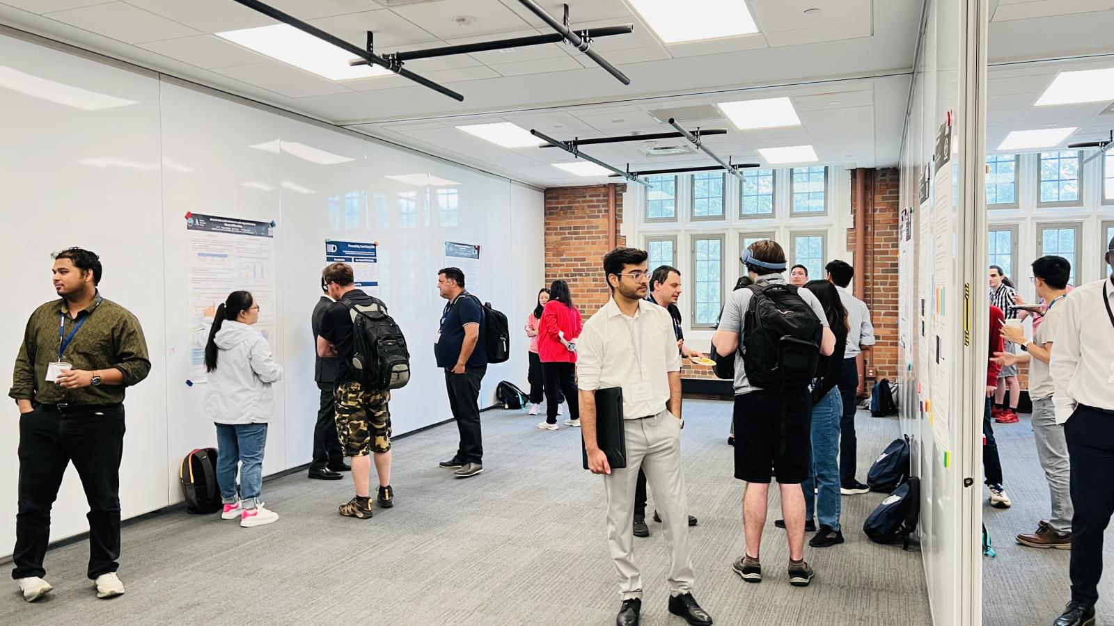 Conference Attendees viewing posters