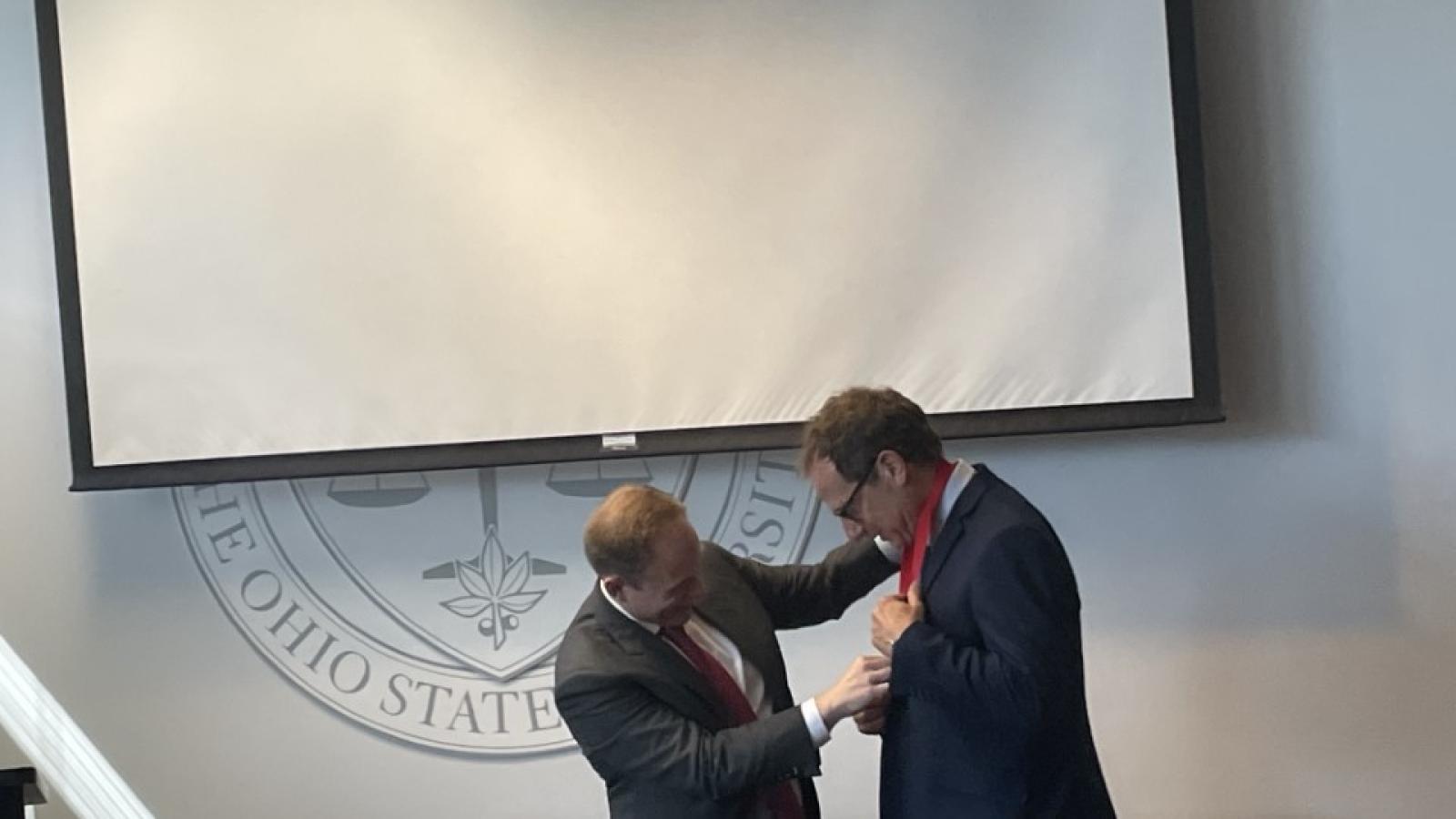 DH accepting medal