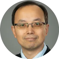 Headshot of Zhiqiang Lin wearing glasses, a suit, and a tie against a neutral background.